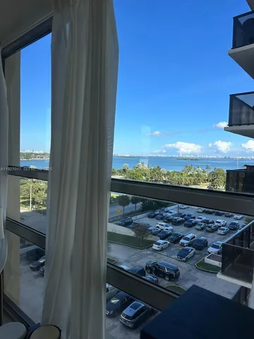 a view of a lake from a corridor