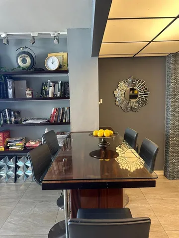 a view of a workspace with furniture