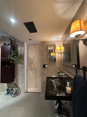 a room with gym equipment and a mirror