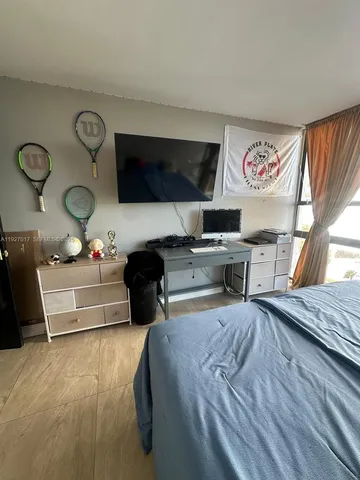 a bedroom with a bed and cabinets