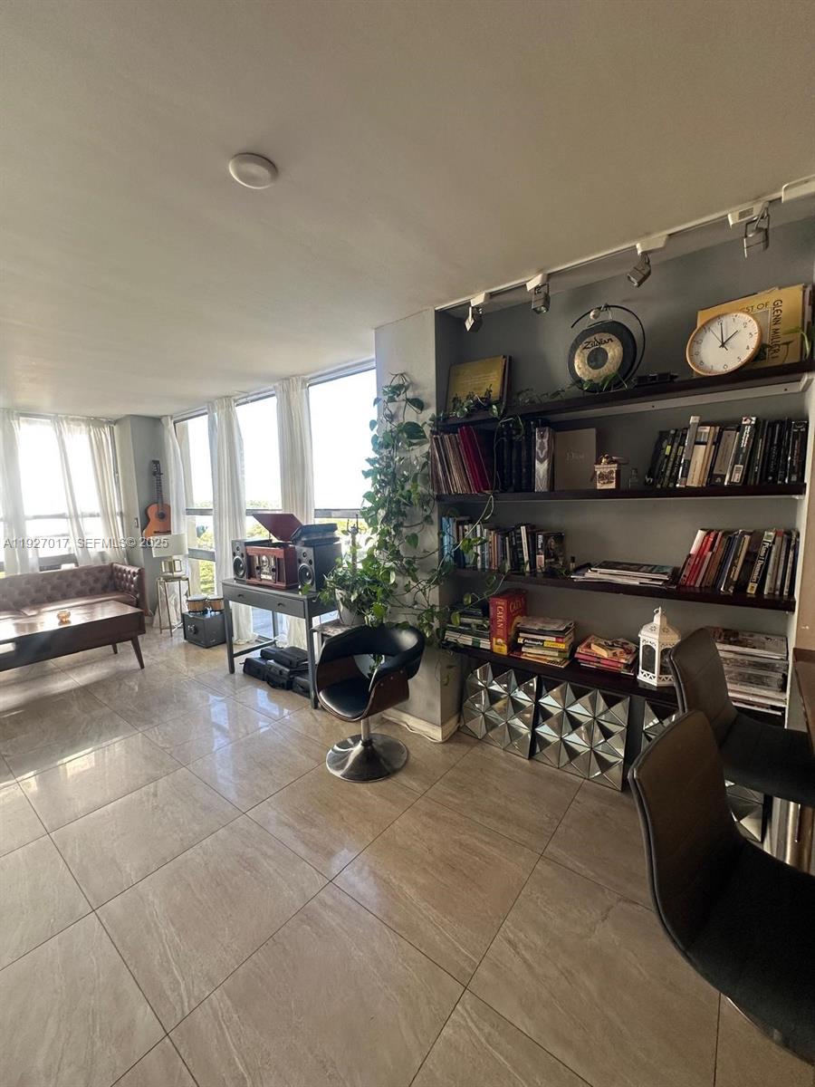 600 Northeast 36th Street, Unit 701 Miami, FL 33137 - Photo 8 of 19 a living room filled with furniture and a couch