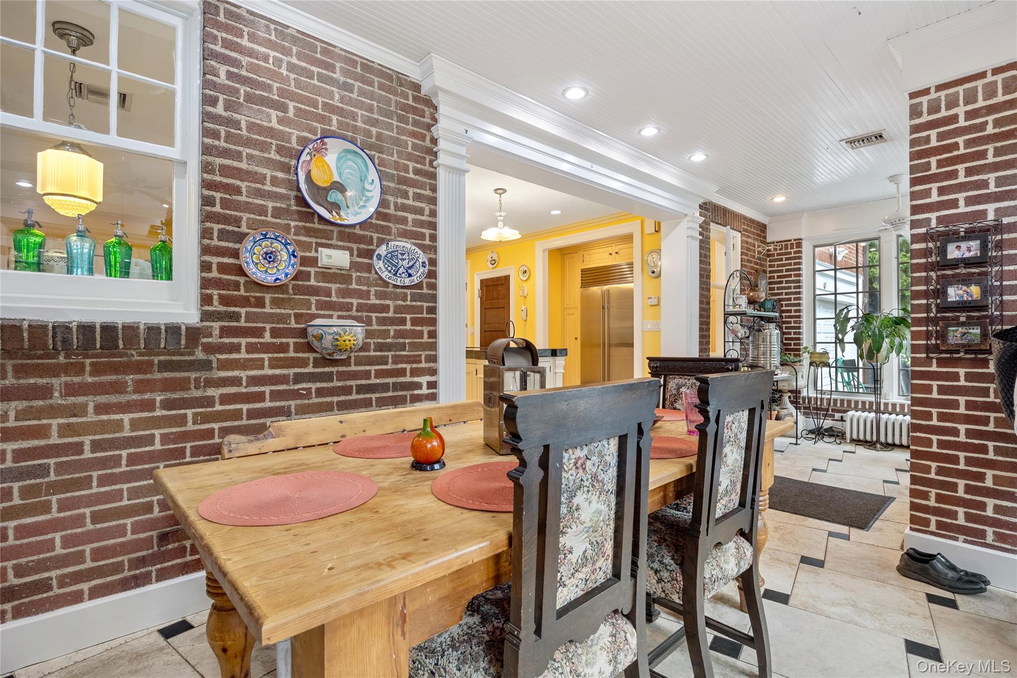 1-27 Beverly Road Queens, NY 11363 - Photo 35 of 46 a view of a dining room with furniture and chandelier