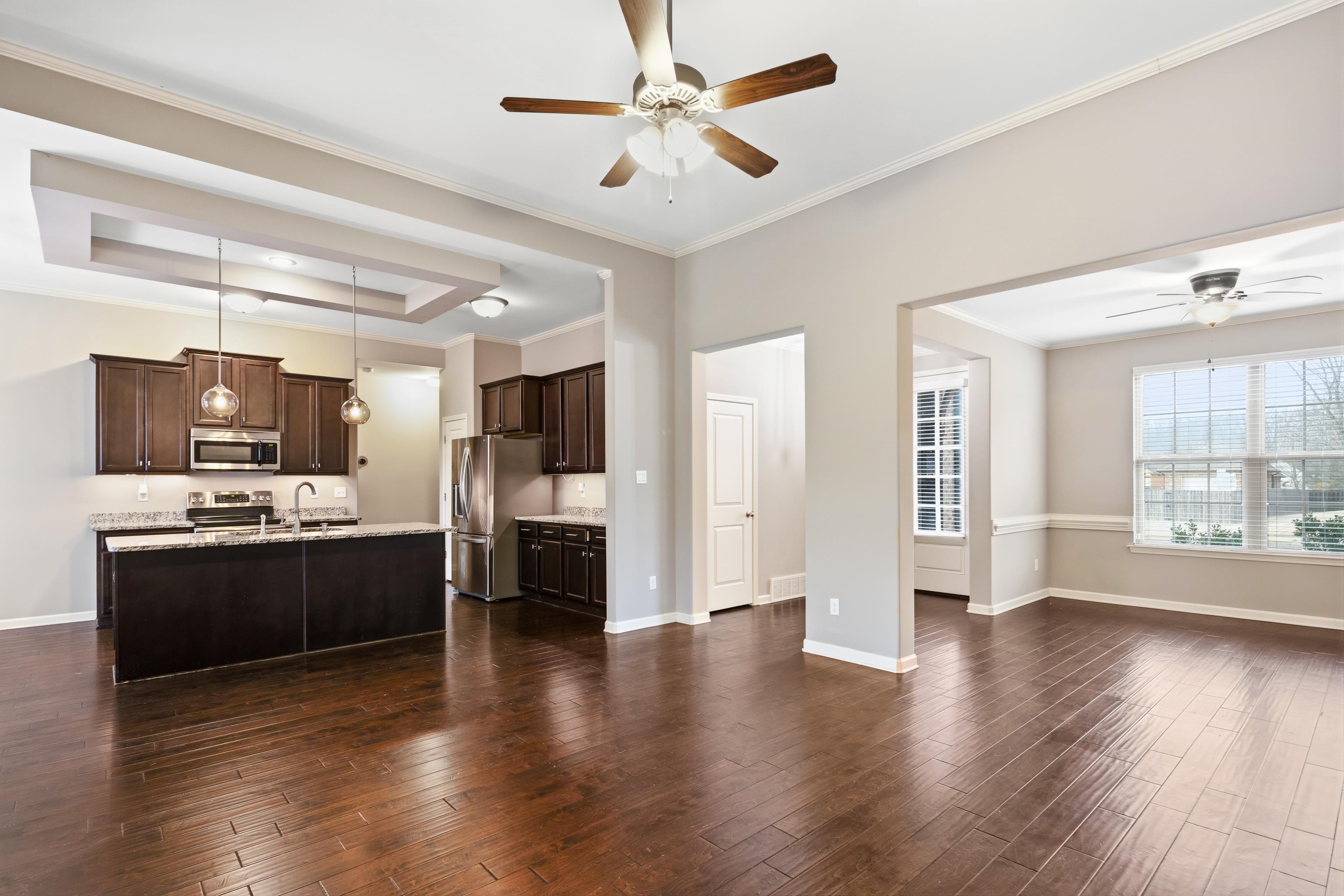7313 Shadow Run Lane Bartlett, TN 38002 - Photo 12 of 40 a large kitchen with cabinets and stainless steel appliances