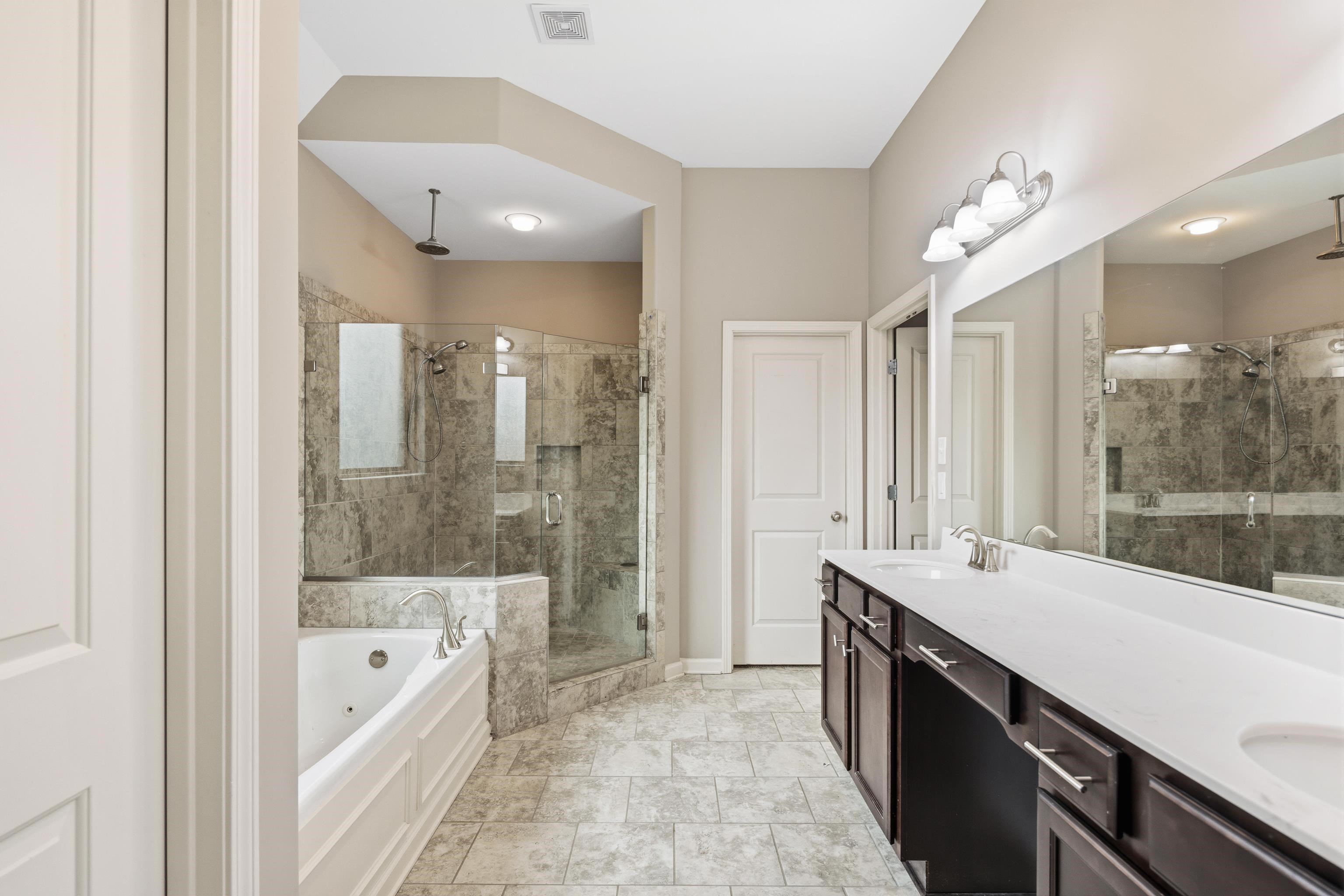 7313 Shadow Run Lane Bartlett, TN 38002 - Photo 2 of 40 a large bathroom with a large tub shower and sink
