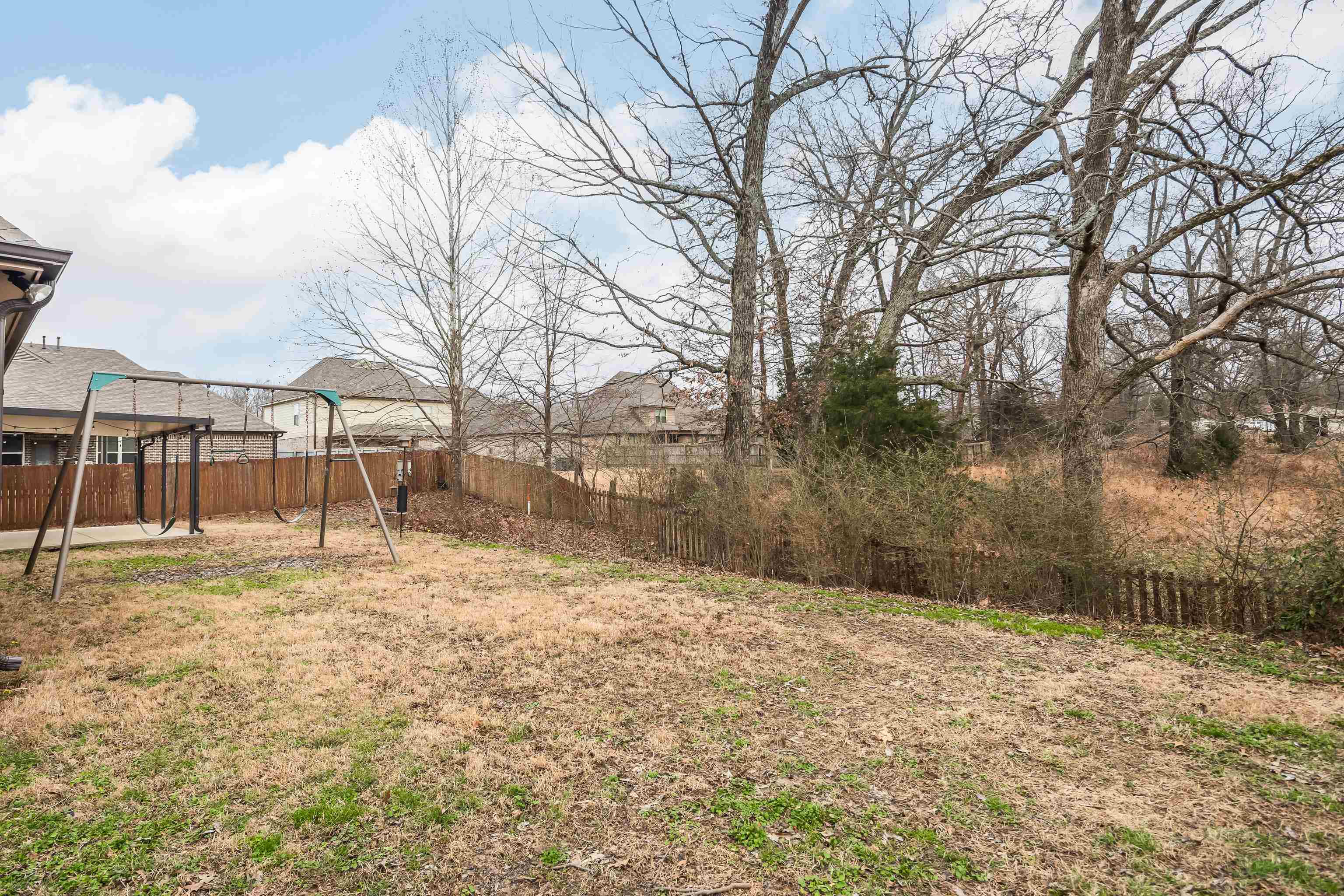 7313 Shadow Run Lane Bartlett, TN 38002 - Photo 24 of 40 a backyard of a house with lots of green space