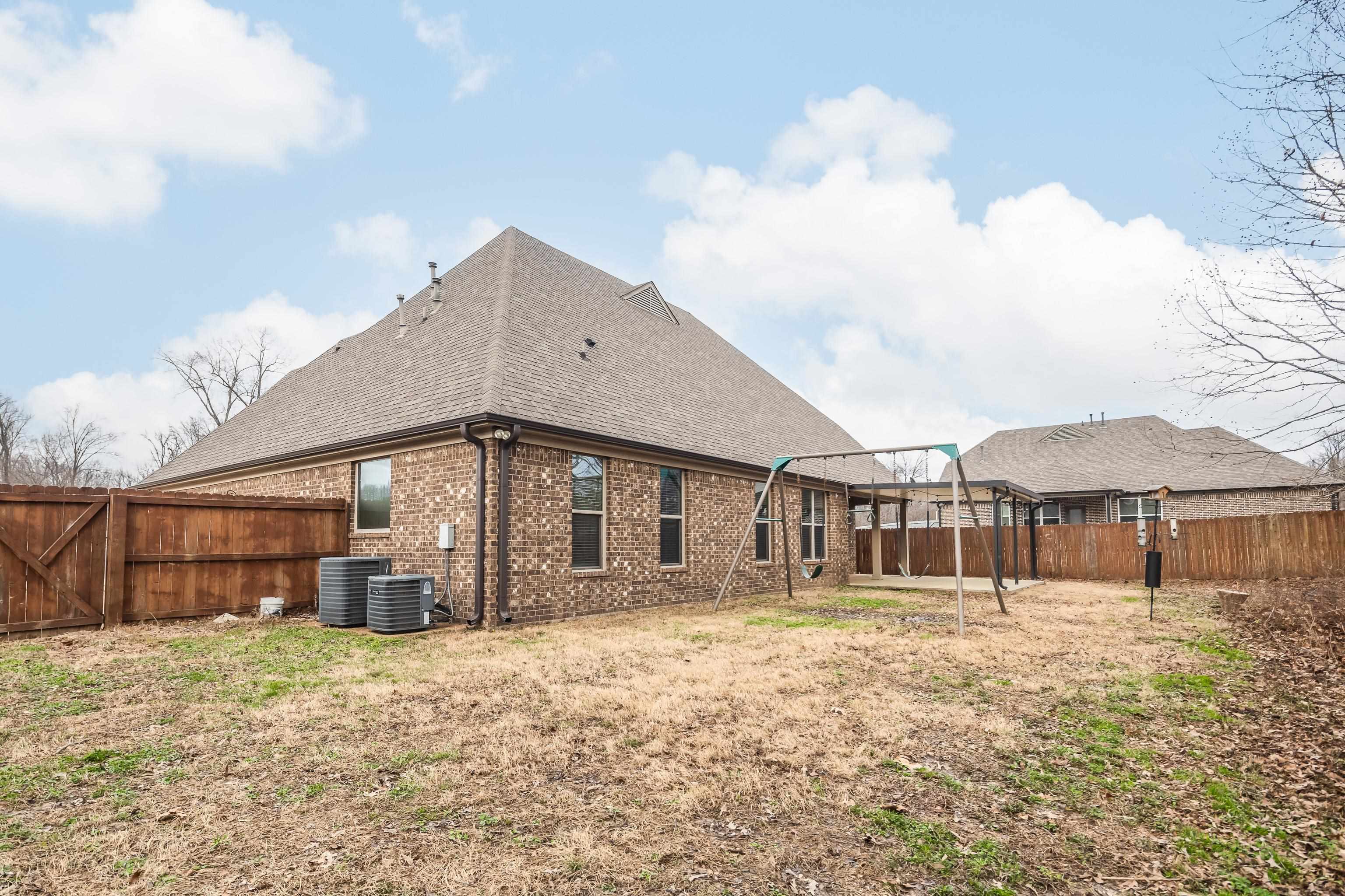 7313 Shadow Run Lane Bartlett, TN 38002 - Photo 25 of 40 a front view of a house with a yard