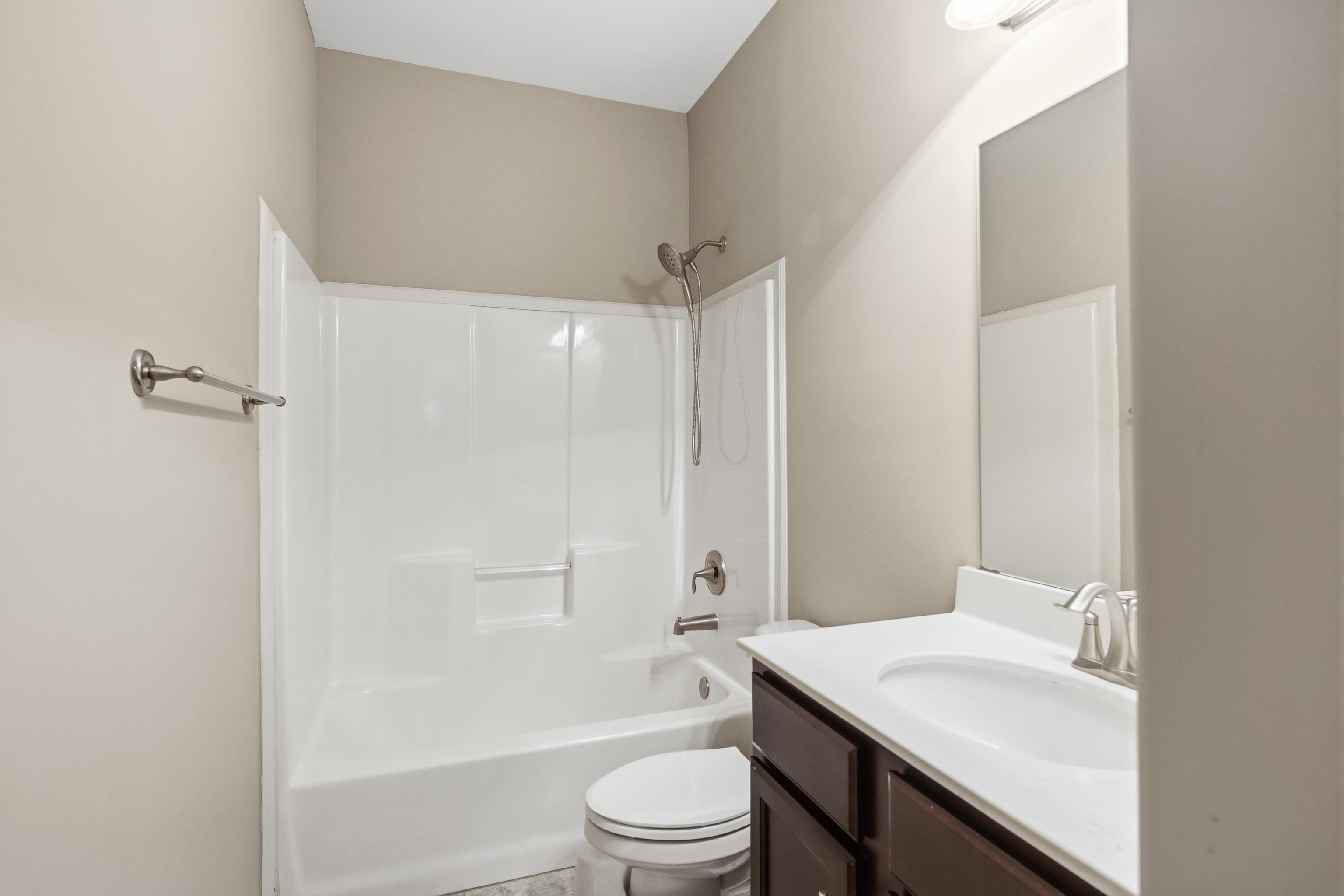 7313 Shadow Run Lane Bartlett, TN 38002 - Photo 32 of 40 a bathroom with a sink a toilet and shower