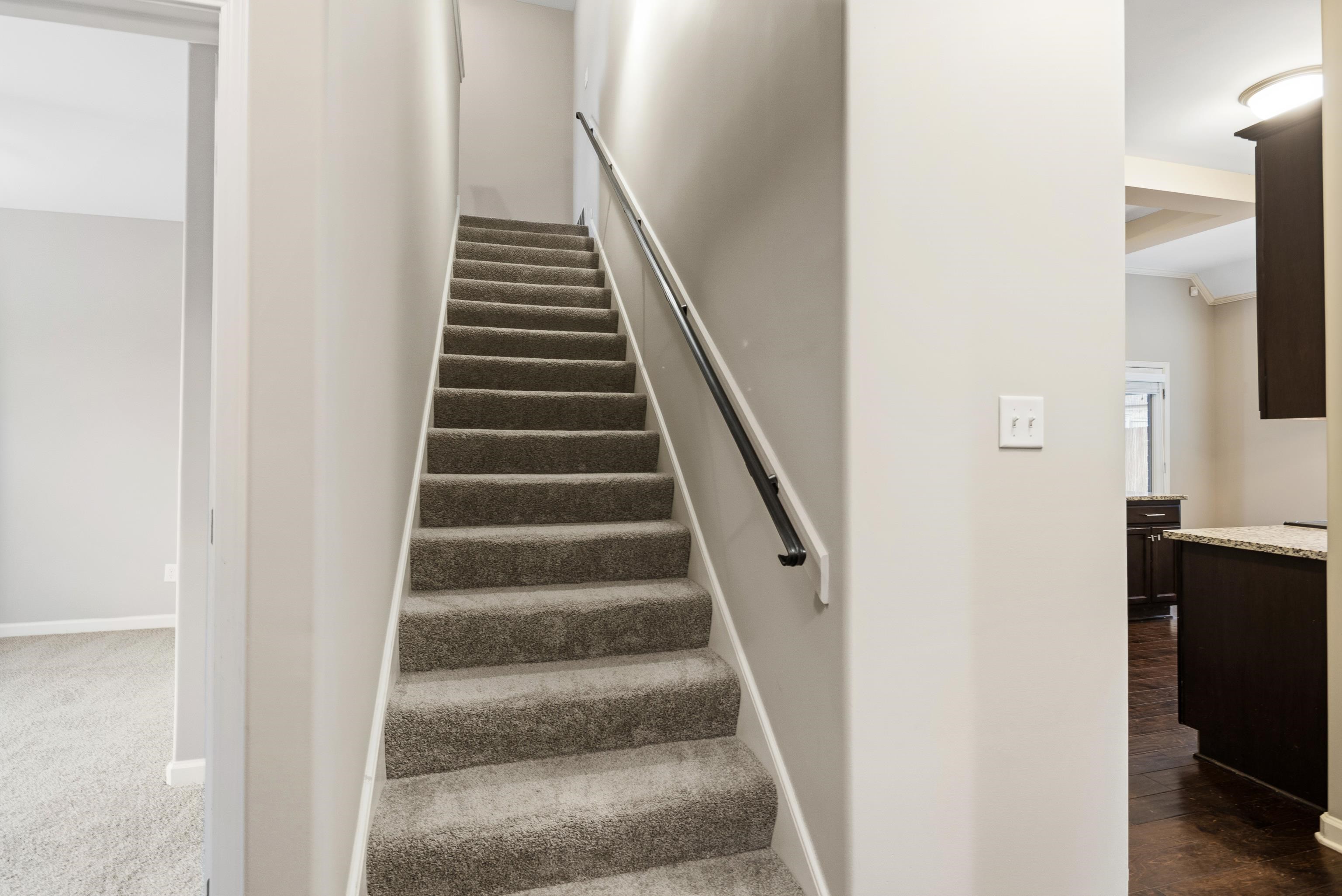 7313 Shadow Run Lane Bartlett, TN 38002 - Photo 33 of 40 a view of staircase with white walls and a window