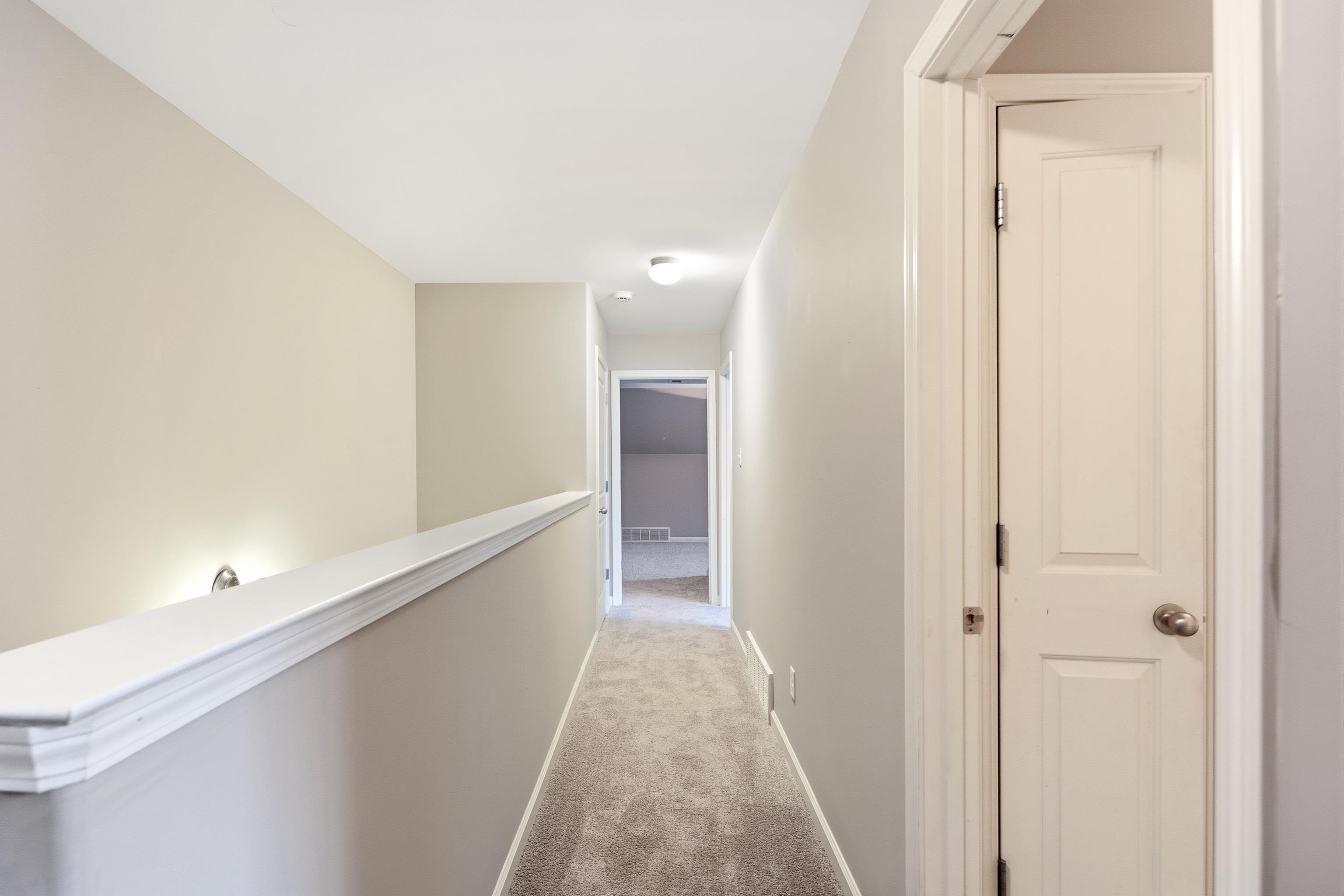 7313 Shadow Run Lane Bartlett, TN 38002 - Photo 36 of 40 a view of a hallway with wooden floor