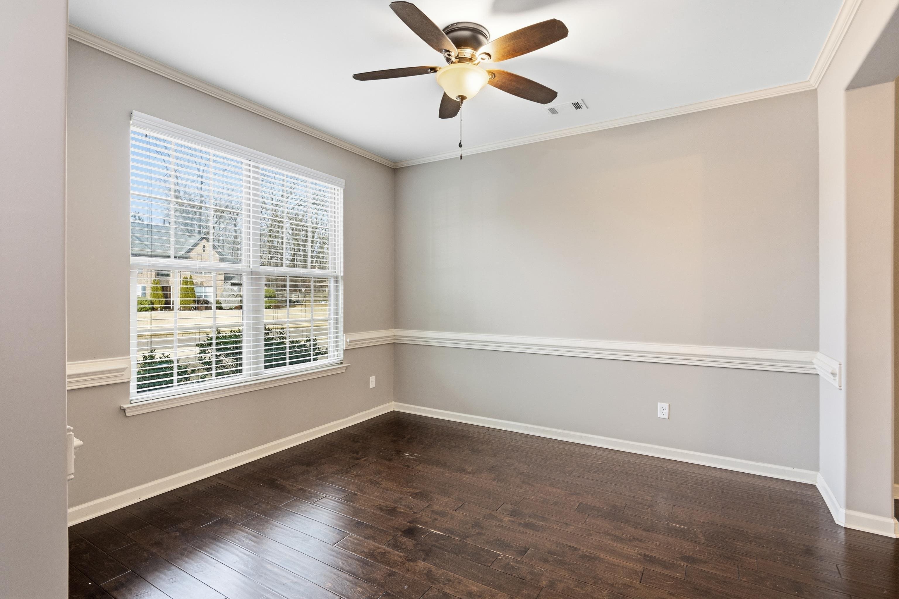 7313 Shadow Run Lane Bartlett, TN 38002 - Photo 8 of 40 an empty room with a window and a ceiling fan