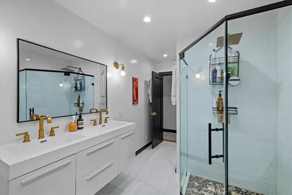 a bathroom with a shower and a tub