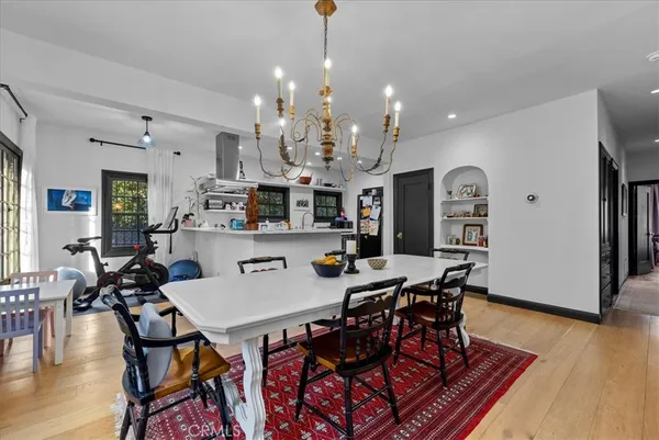 a view of a dining area with furniture and wooden floor