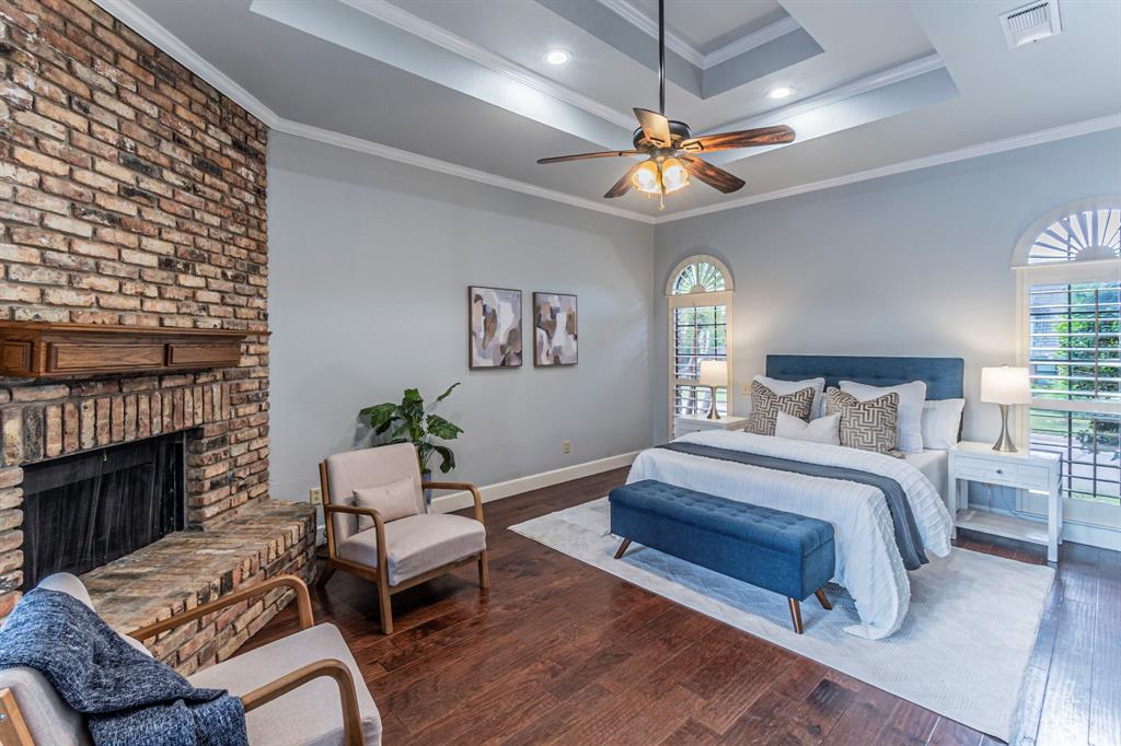 2714 Ridge Top Lane Arlington, TX 76006 - Photo 19 of 37 Bedroom with dark wood-style flooring, crown molding, ceiling fan, a brick fireplace, and recessed lighting