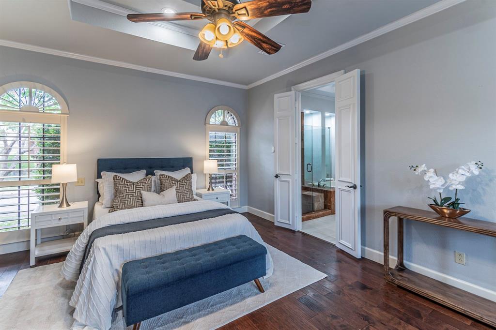 2714 Ridge Top Lane Arlington, TX 76006 - Photo 20 of 37 Bedroom with crown molding, dark wood-style flooring, ensuite bathroom, and a ceiling fan