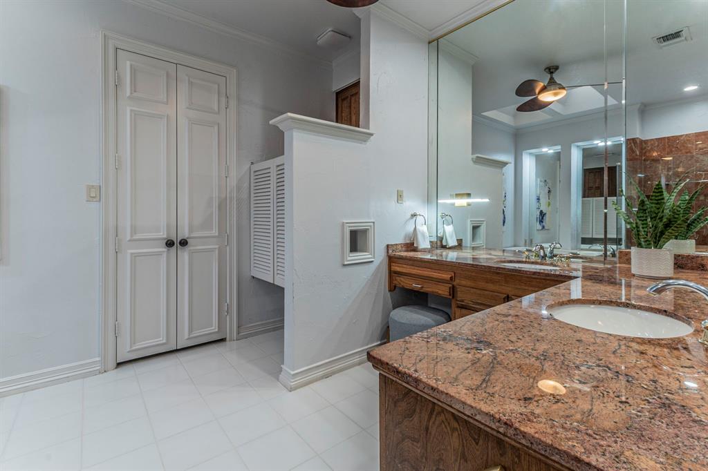 2714 Ridge Top Lane Arlington, TX 76006 - Photo 21 of 37 Full bathroom with ceiling fan, vanity, ornamental molding, light tile patterned flooring, and a closet