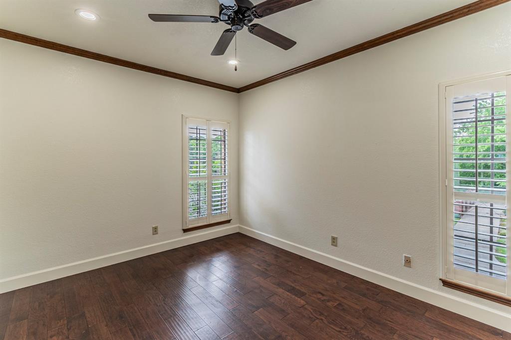 2714 Ridge Top Lane Arlington, TX 76006 - Photo 27 of 37 Spare room with dark wood finished floors, crown molding, ceiling fan, a textured wall, and recessed lighting
