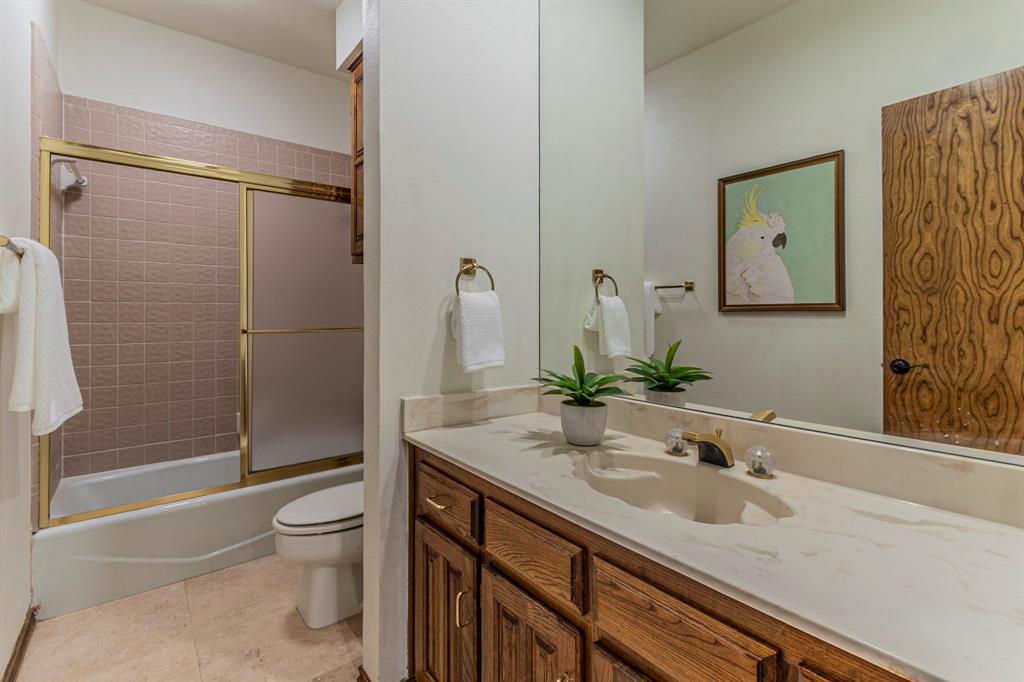 2714 Ridge Top Lane Arlington, TX 76006 - Photo 28 of 37 Bathroom with vanity, shower / bath combination with glass door, and light tile patterned floors