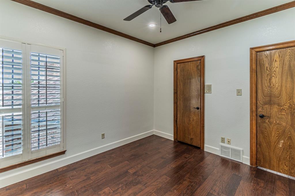 2714 Ridge Top Lane Arlington, TX 76006 - Photo 32 of 37 Spare room with crown molding, dark wood-type flooring, and ceiling fan