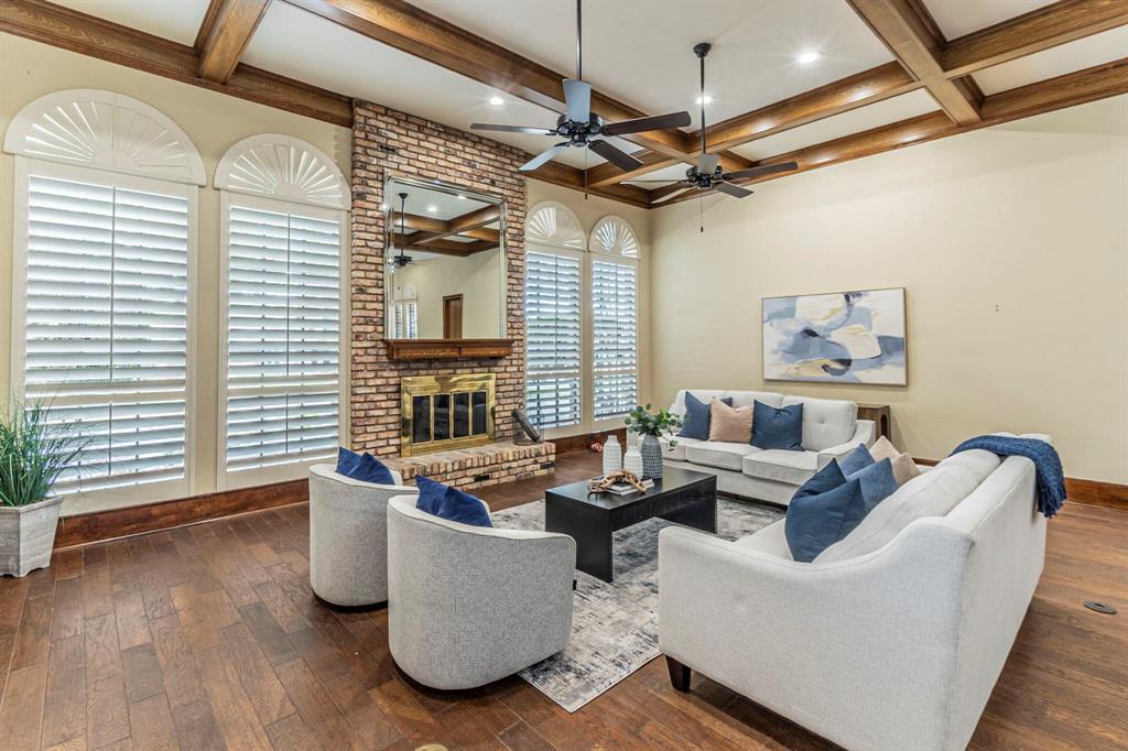 2714 Ridge Top Lane Arlington, TX 76006 - Photo 4 of 37 Living area with a brick fireplace, coffered ceiling, dark wood finished floors, recessed lighting, and a ceiling fan