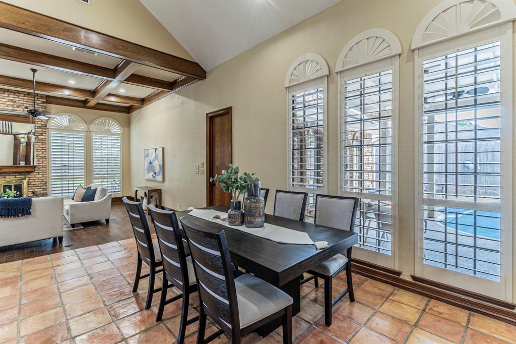 2714 Ridge Top Lane Arlington, TX 76006 - Photo 8 of 37 Dining room featuring vaulted ceiling with beams, a fireplace, and recessed lighting