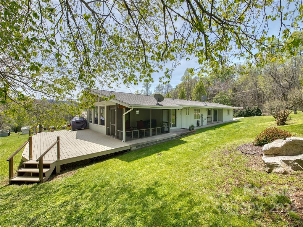 322 Kitchens Branch Road Sylva, NC 28779 - Photo 3 of 48 a view of a house with a yard and sitting area