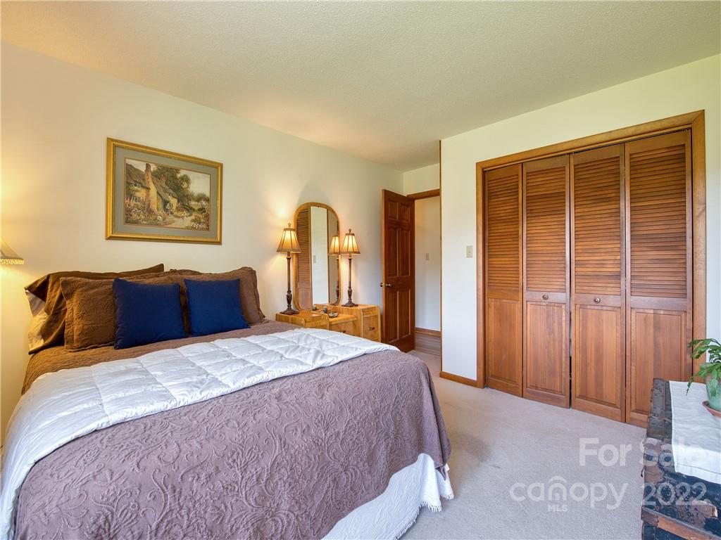 322 Kitchens Branch Road Sylva, NC 28779 - Photo 36 of 48 a bedroom with bed and window