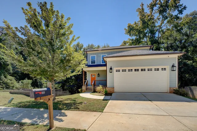 a front view of a house with garden