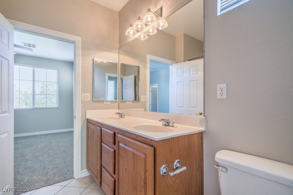 8121 Altamont Ridge Street Las Vegas, NV 89113 - Photo 14 of 27 Bathroom with healthy amount of natural light, dou