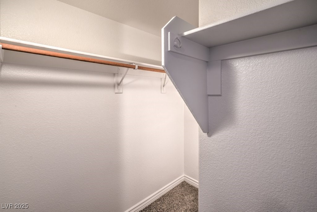 8121 Altamont Ridge Street Las Vegas, NV 89113 - Photo 19 of 27 Walk in closet with carpet flooring