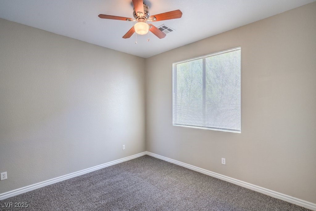 8121 Altamont Ridge Street Las Vegas, NV 89113 - Photo 20 of 27 Carpeted empty room with baseboards and ceiling fa