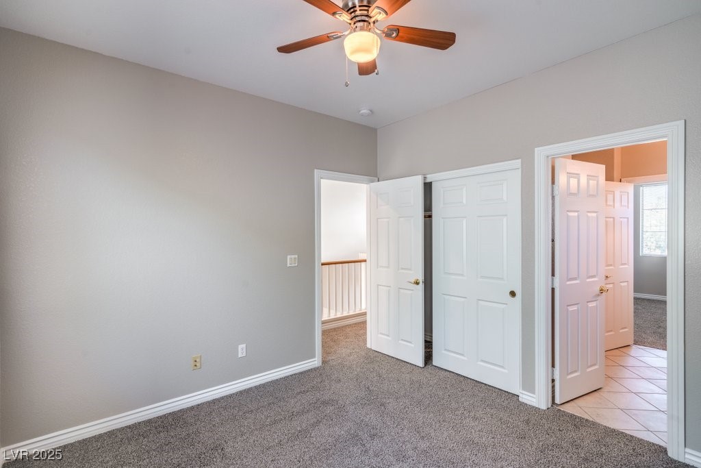 8121 Altamont Ridge Street Las Vegas, NV 89113 - Photo 21 of 27 Unfurnished bedroom with light carpet, a closet, a