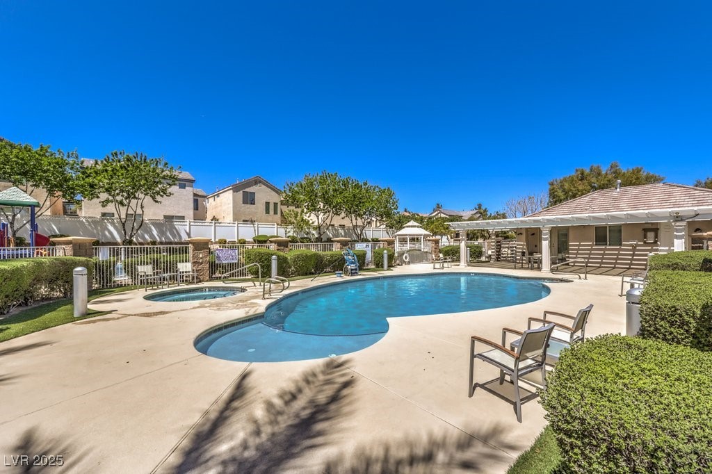 8121 Altamont Ridge Street Las Vegas, NV 89113 - Photo 27 of 27 Community pool featuring a patio, a community hot