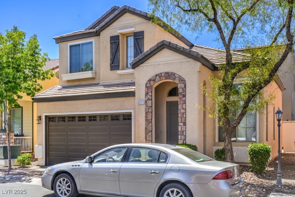 8121 Altamont Ridge Street Las Vegas, NV 89113 - Photo 3 of 27 View of front of property featuring a tile roof, a