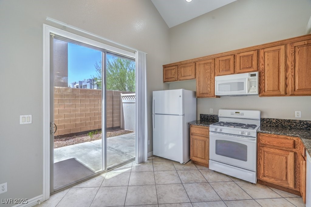 8121 Altamont Ridge Street Las Vegas, NV 89113 - Photo 9 of 27 Kitchen has 16x16 diagonal tile floor, granite cou