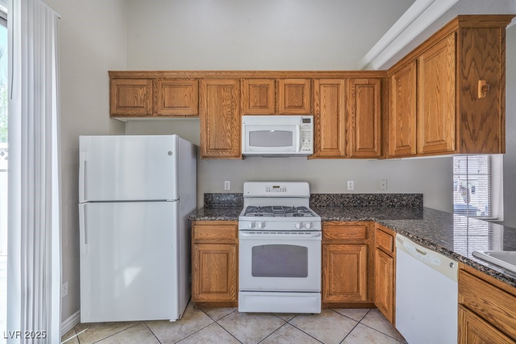 8121 Altamont Ridge Street Las Vegas, NV 89113 - Photo 10 of 27 Kitchen has 16x16 diagonal tile floor, granite cou