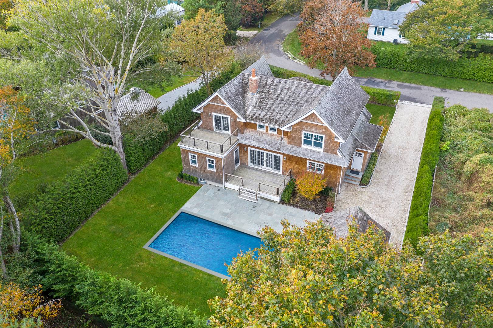 12 Inkberry Street East Hampton, NY 11937 - Photo 1 of 25 an aerial view of a house with swimming pool garden and patio