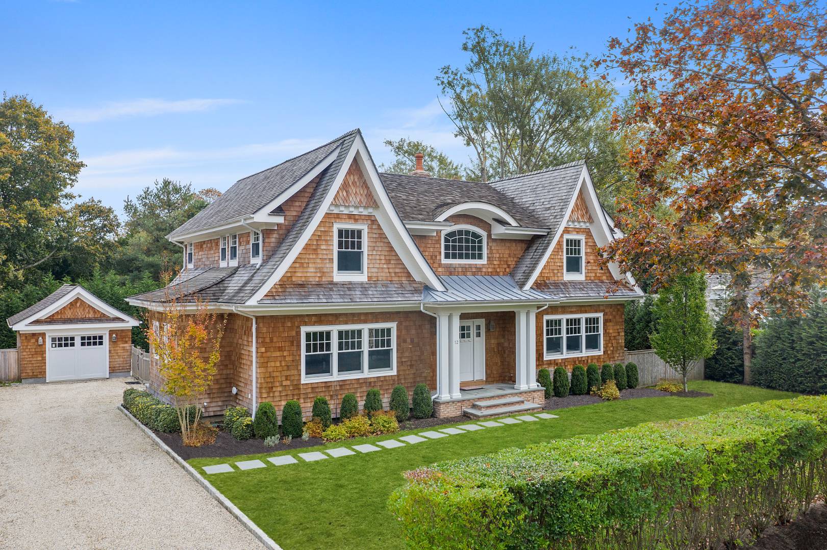 12 Inkberry Street East Hampton, NY 11937 - Photo 2 of 25 a front view of a house with a yard