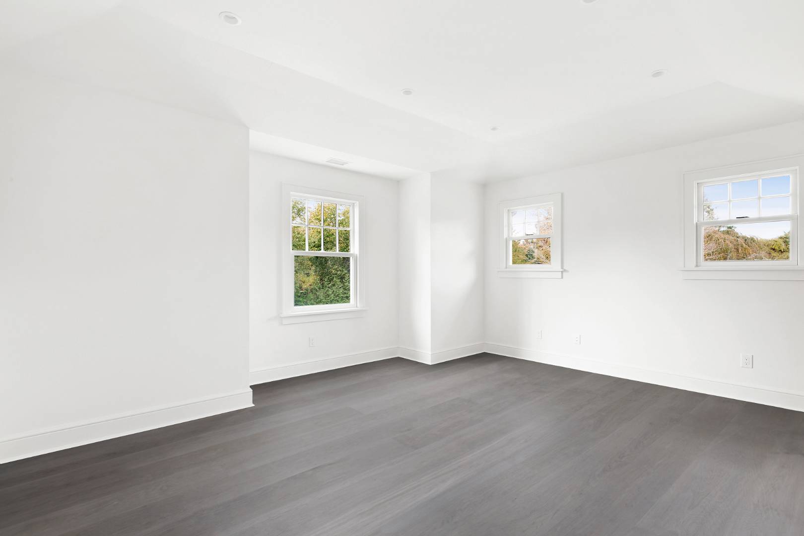 12 Inkberry Street East Hampton, NY 11937 - Photo 14 of 25 an empty room with wooden floor and windows
