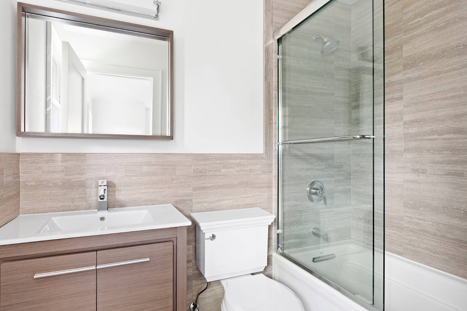 12 Inkberry Street East Hampton, NY 11937 - Photo 16 of 25 a bathroom with a sink toilet and shower