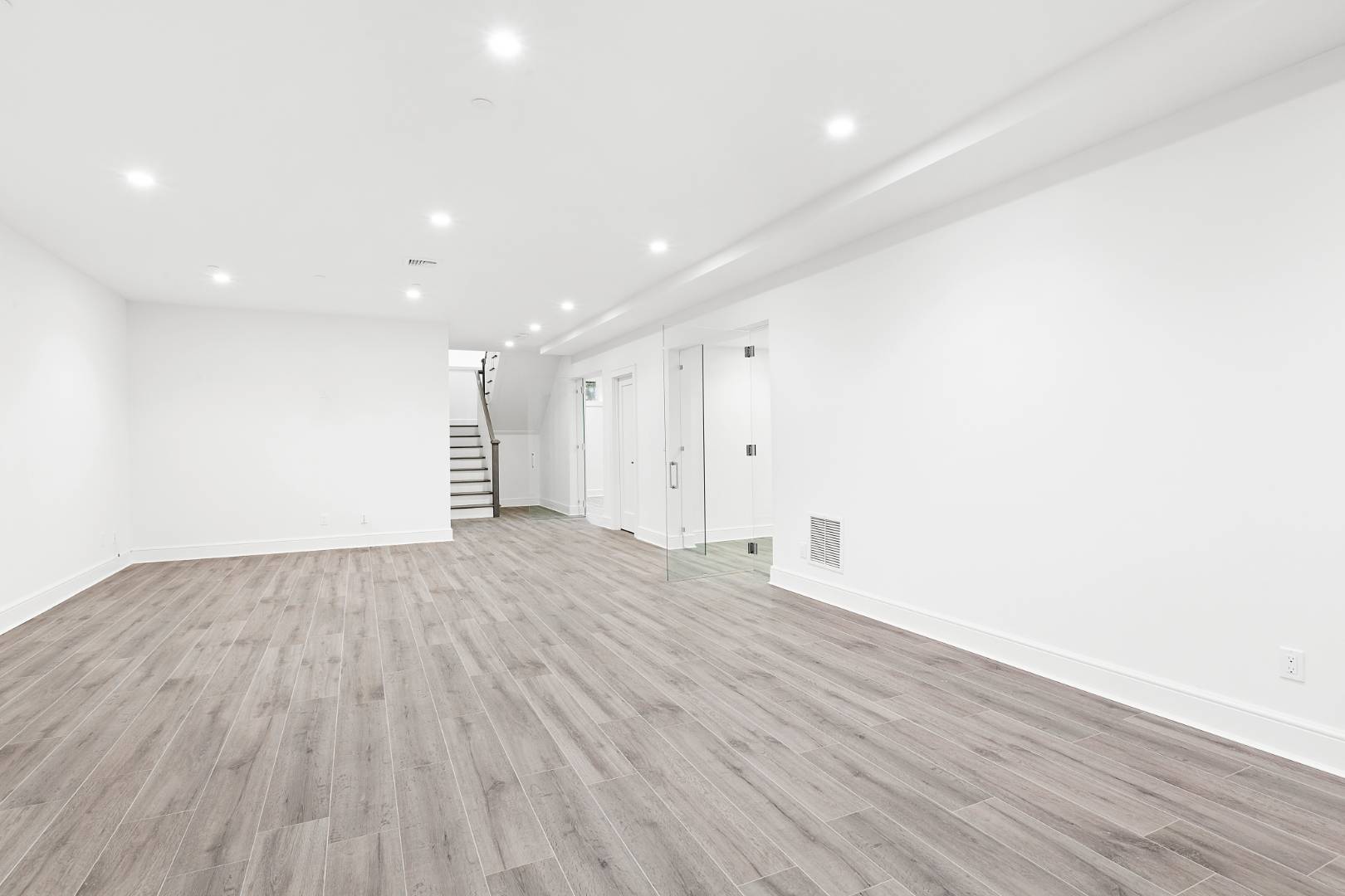 12 Inkberry Street East Hampton, NY 11937 - Photo 17 of 25 a view of empty room with wooden floor