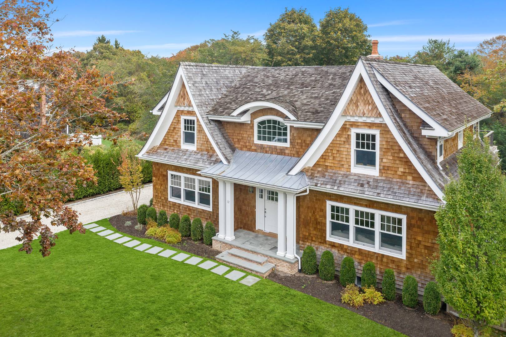 12 Inkberry Street East Hampton, NY 11937 - Photo 3 of 25 front view of a house with a yard