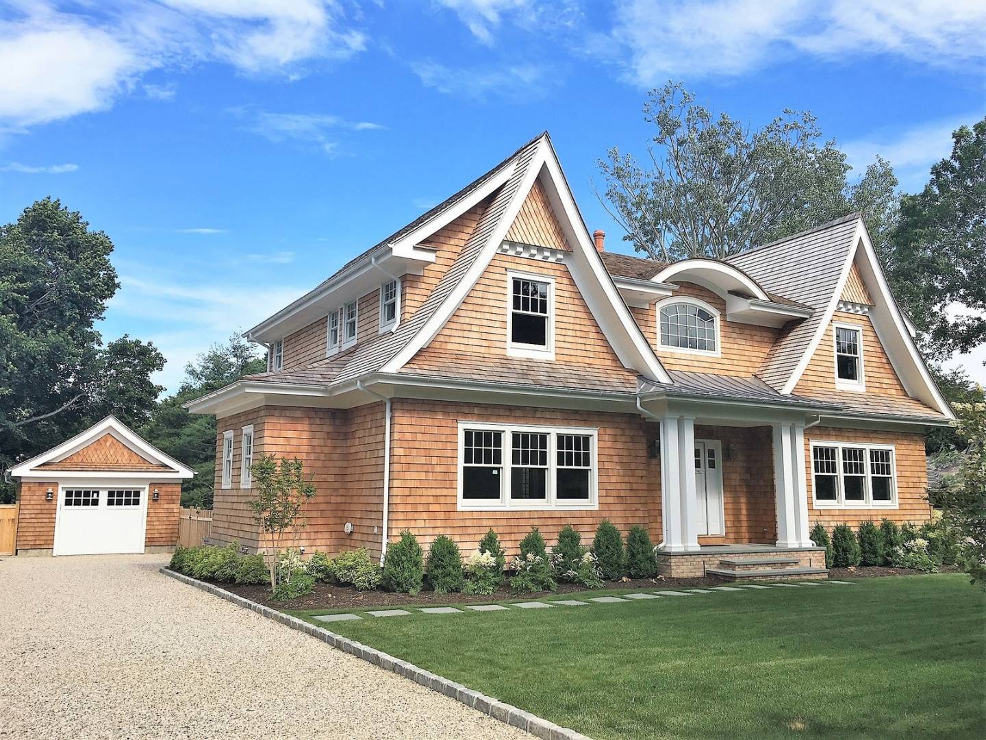 12 Inkberry Street East Hampton, NY 11937 - Photo 22 of 25 a front view of a house with a yard