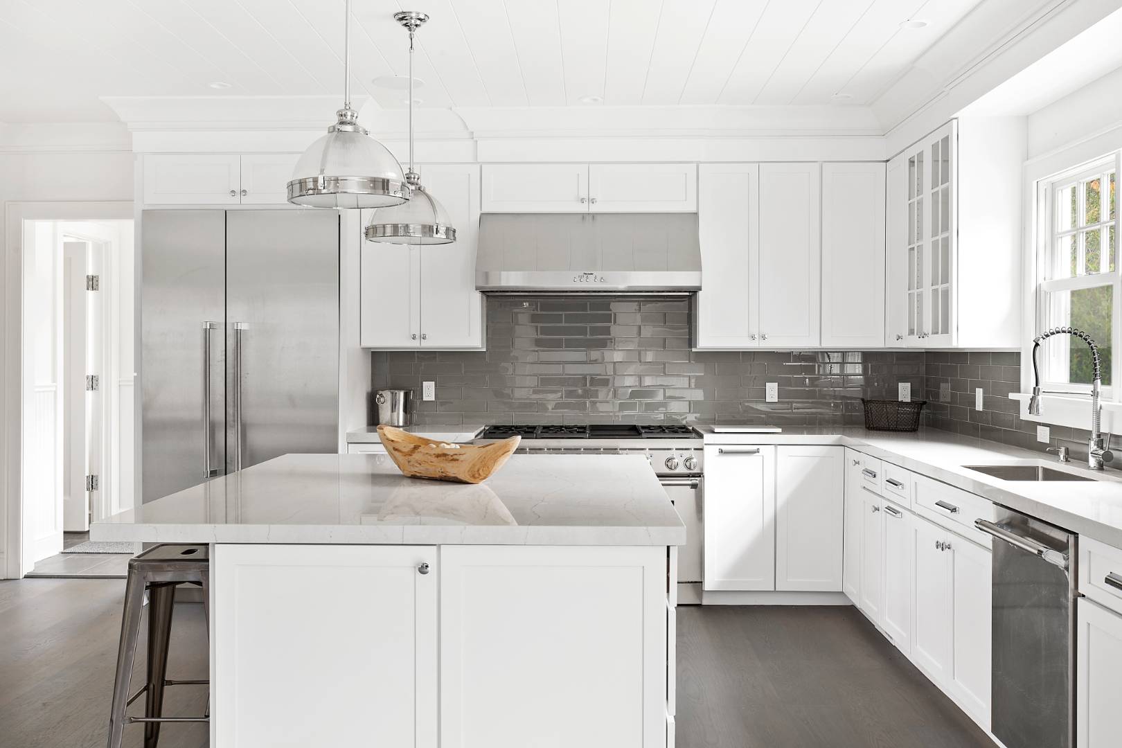 12 Inkberry Street East Hampton, NY 11937 - Photo 7 of 25 a kitchen with stainless steel appliances granite countertop a sink stove and refrigerator