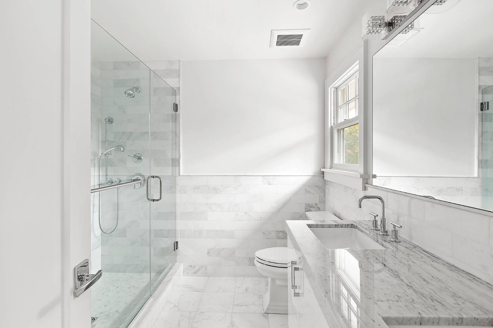 12 Inkberry Street East Hampton, NY 11937 - Photo 10 of 25 a bathroom with a bathtub shower sink and toilet