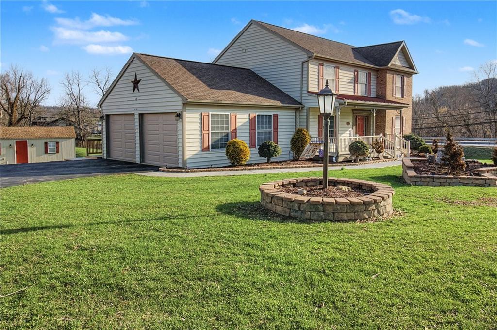 a front view of a house with a yard
