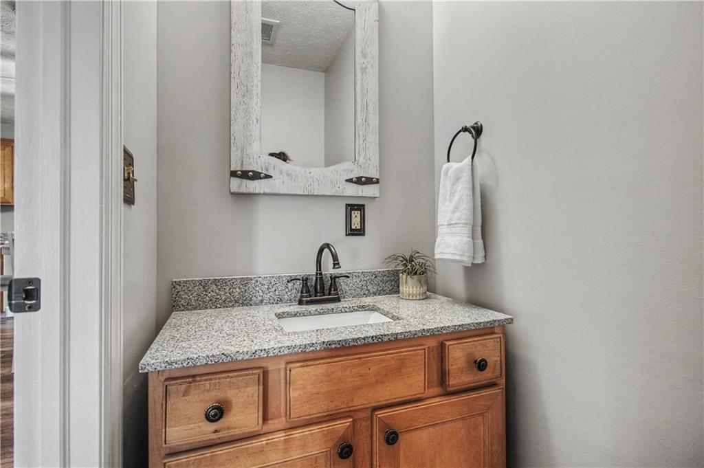 102 Sycamore Lane Washington, PA 15301 - Photo 16 of 33 a bathroom with a granite countertop sink and a mirror