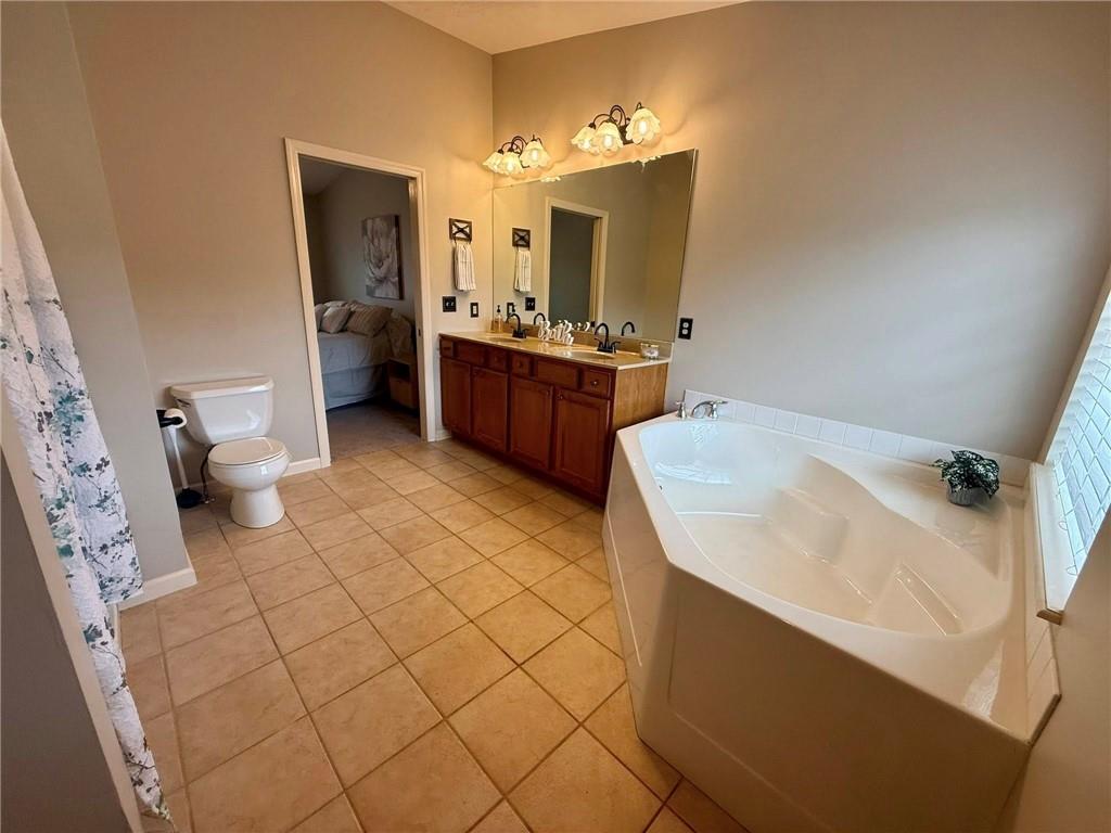 102 Sycamore Lane Washington, PA 15301 - Photo 21 of 33 a spacious bathroom with a sink a toilet and mirror