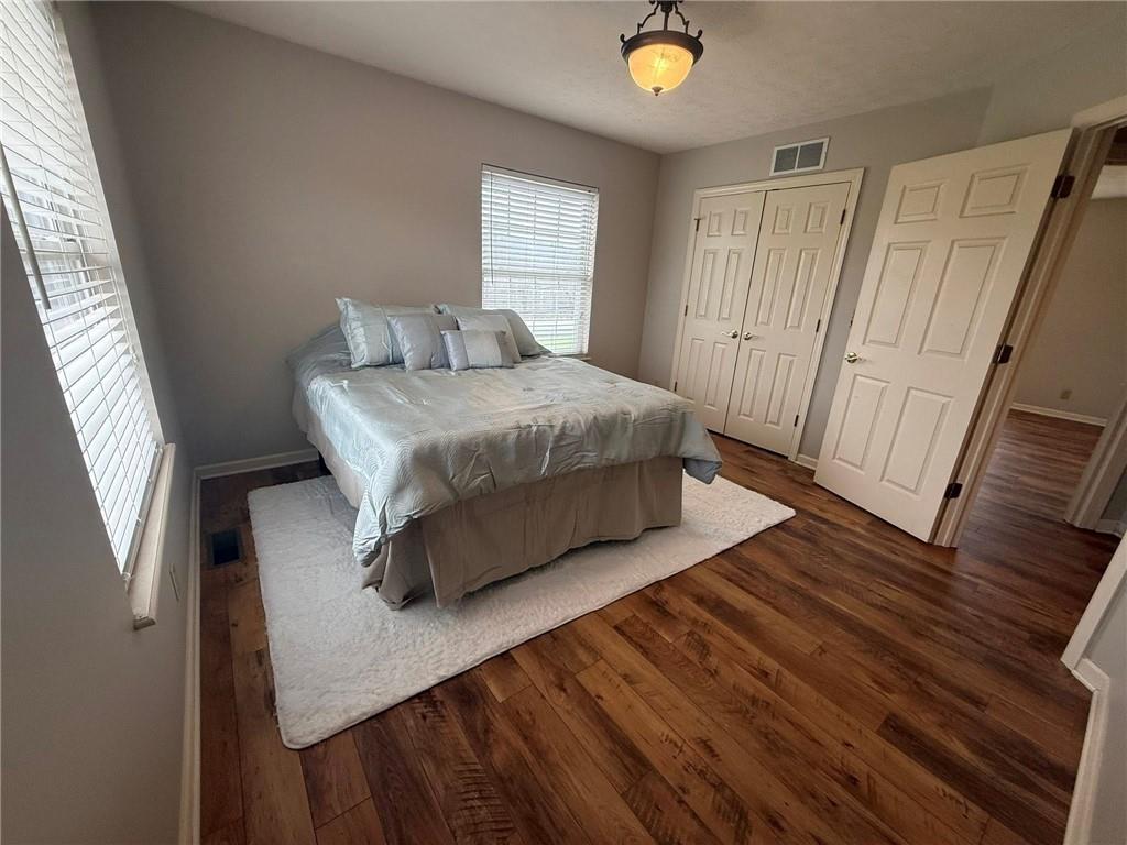 102 Sycamore Lane Washington, PA 15301 - Photo 27 of 33 a bedroom with a bed and wooden floor