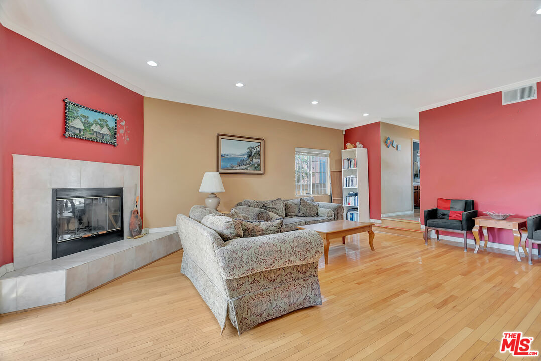 448 West 64th Street Inglewood, CA 90302 - Photo 14 of 39 a living room with furniture and a fireplace