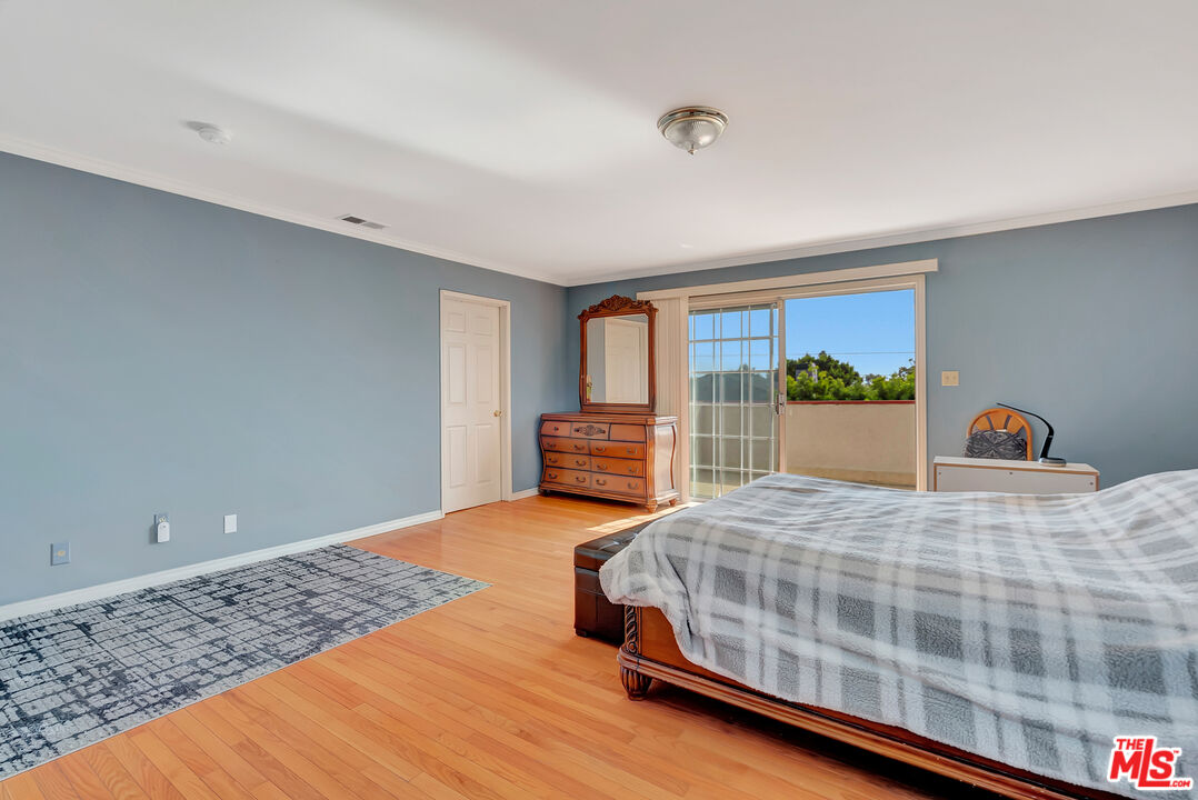 448 West 64th Street Inglewood, CA 90302 - Photo 19 of 39 a bedroom with a bed and window